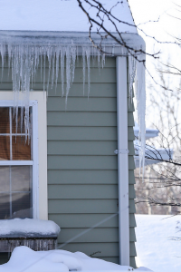 Icicles hang off of roof during cold winter weather.